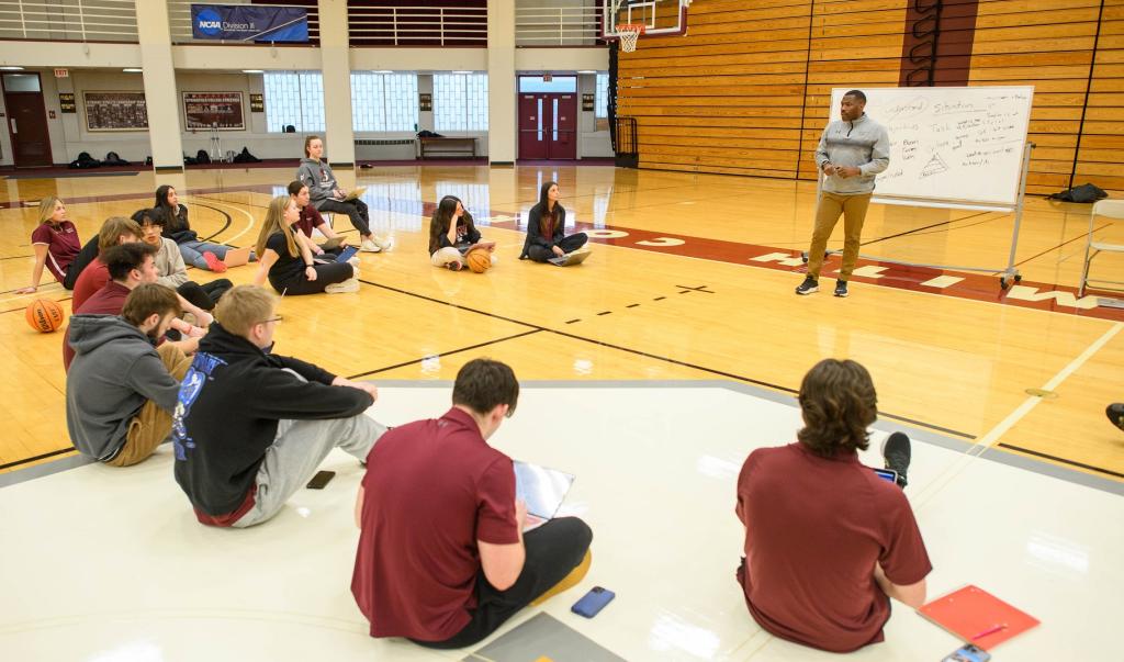Springfield College Assistant Professor of Physical Education Korey Boyd conducts a PE lab inside Blake Arena