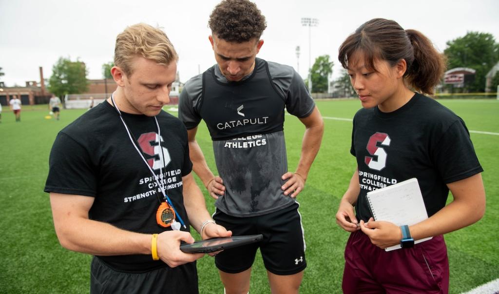 Springfield College Strength and Conditioning students in group huddle