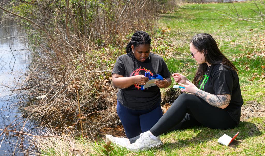 Springfield College environmental science students perform tests at the campus lake on April 22, 2025.
