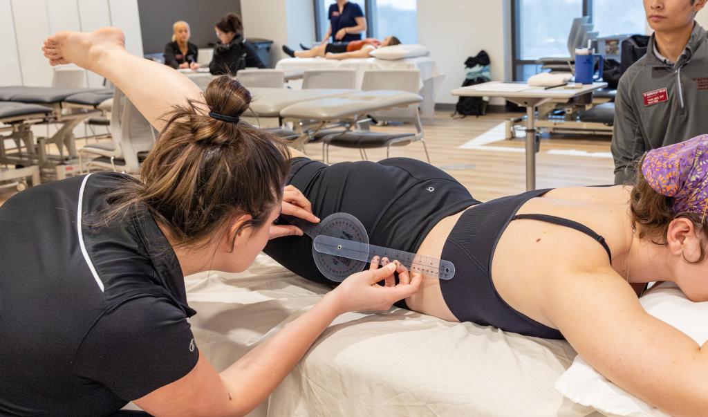 Springfield College physical therapy and dance students collaborating in the new Brown & Cooper Health Sciences Center to assess and apply therapeutic strategies that enhance performance and support physical health. (Luis A Rodriguez)