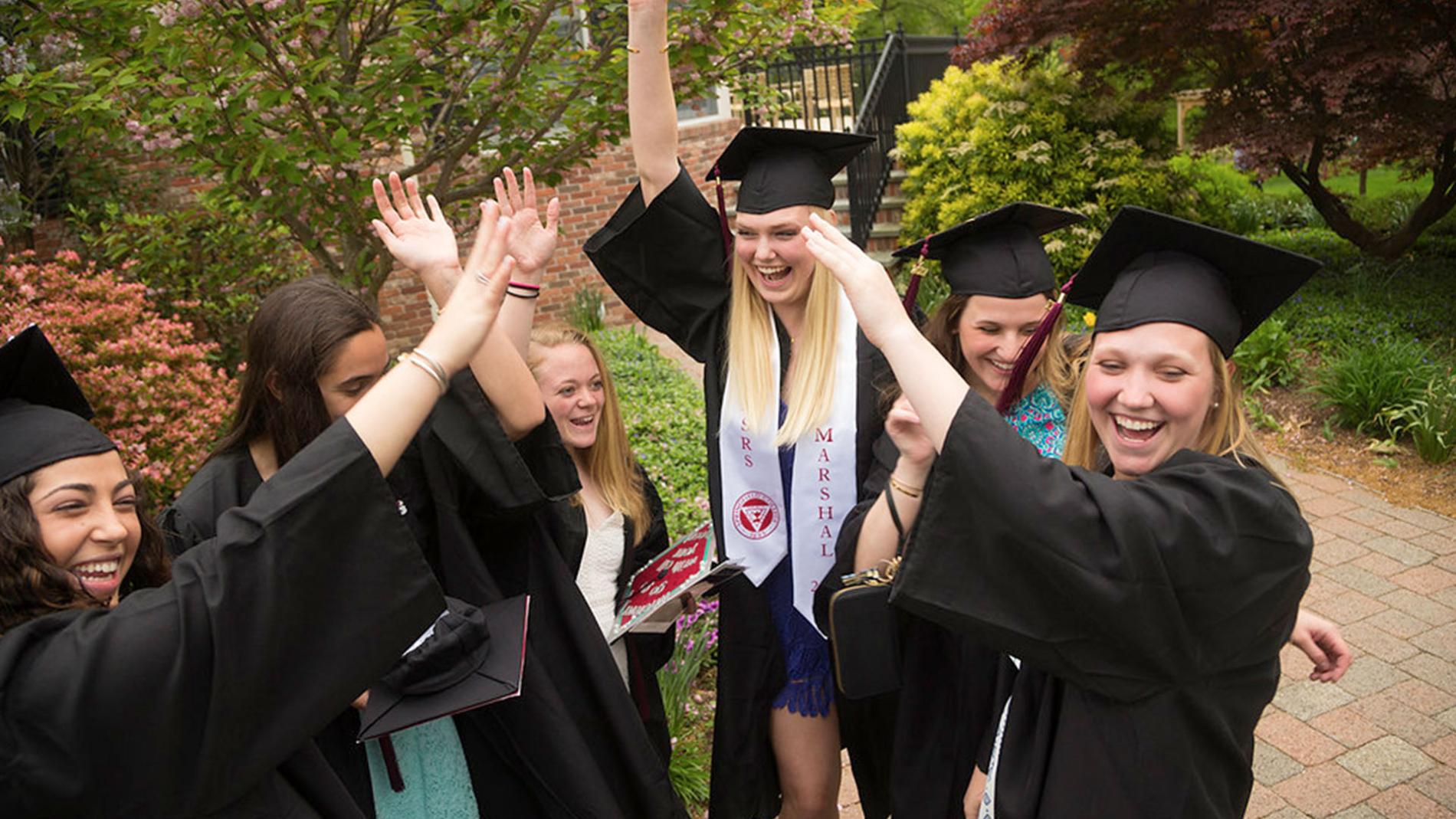 A group of graduates celebrating .