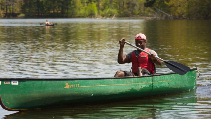 Student canoeing at East Campus