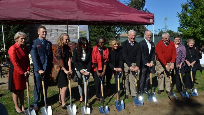 A photo from the groundbreaking of the Learning Commons featuring many leaders from the College.