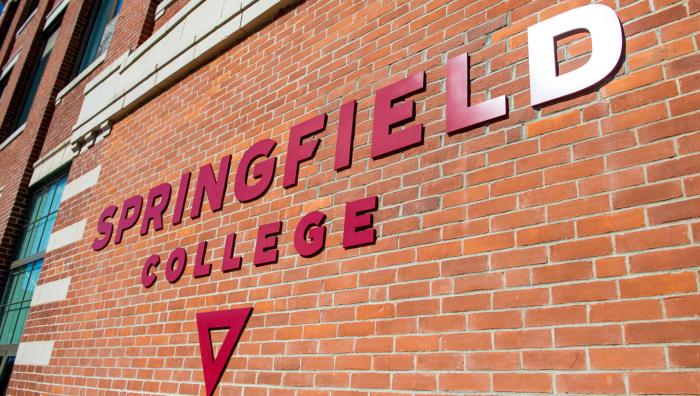 The Springfield College logo on the side of Locklin Hall.
