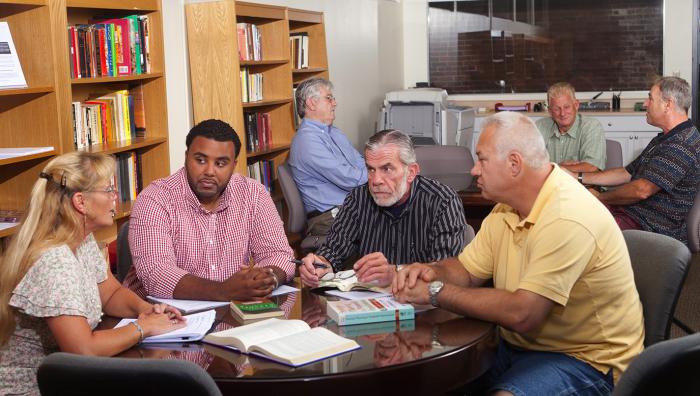 Students talking around a round table