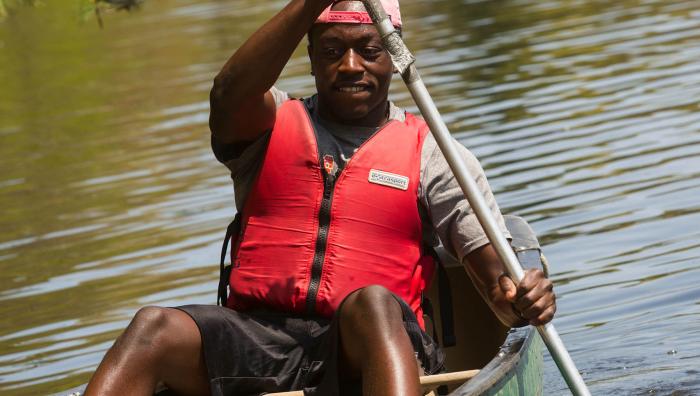 A man in a canoe. 
