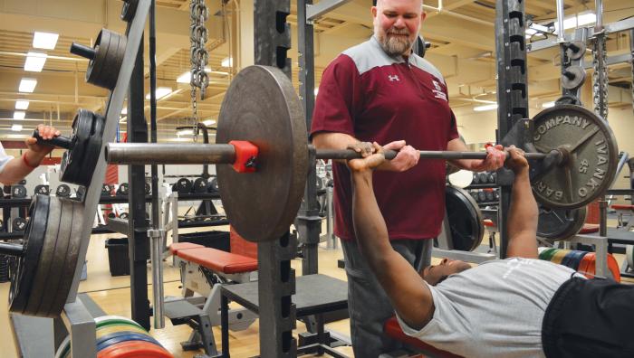 Brian Thompson, PhD, director of strength and conditioning in weight room